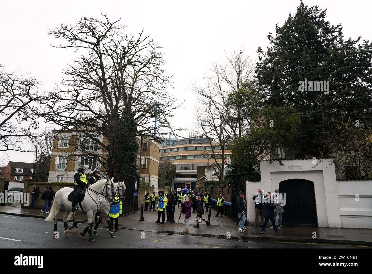 Fans and police presence at the Bovril Gate entrance ahead of the Emirates FA Cup quarter-final match at Stamford Bridge, London. Picture date: Sunday March 17, 2024. Stock Photo