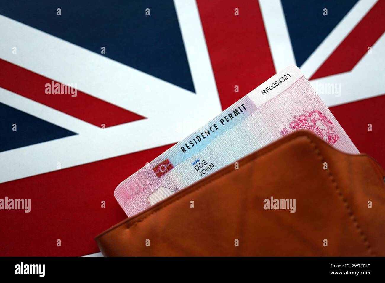 Residence Permit BRP card in purse on Union Jack flag close up Stock Photo