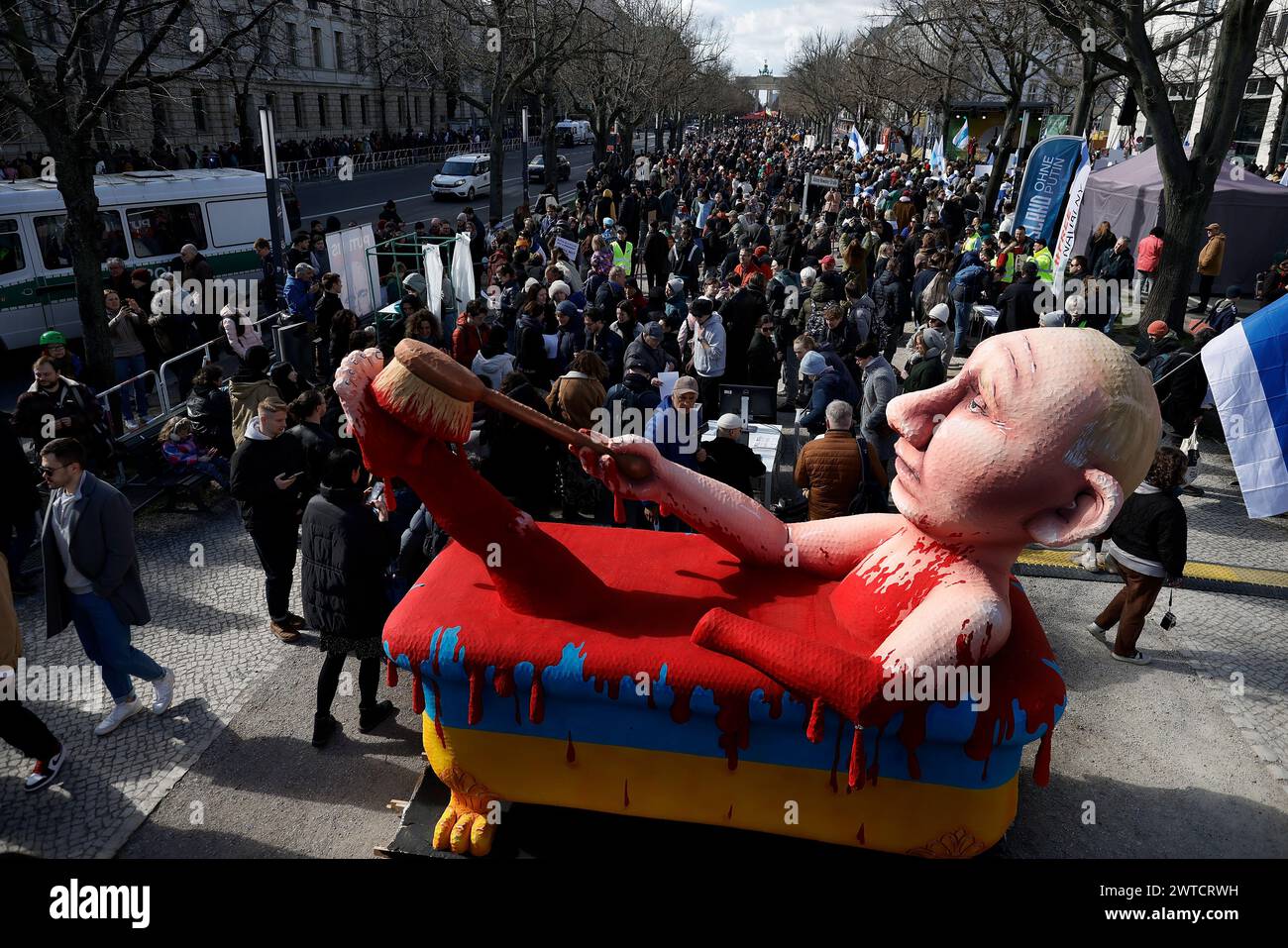 Berlin, Germany. 17th Mar, 2024. A figure depicting Russian President Putin in a bathtub stands at a rally. Participants in a demonstration 'Stop Putin, war, lies and repression' organized by the alliance 'Democracy - Yes' protest against President Putin's policies one month after the death of Kremlin critic Navalny. Credit: Carsten Koall/dpa/Alamy Live News Stock Photo