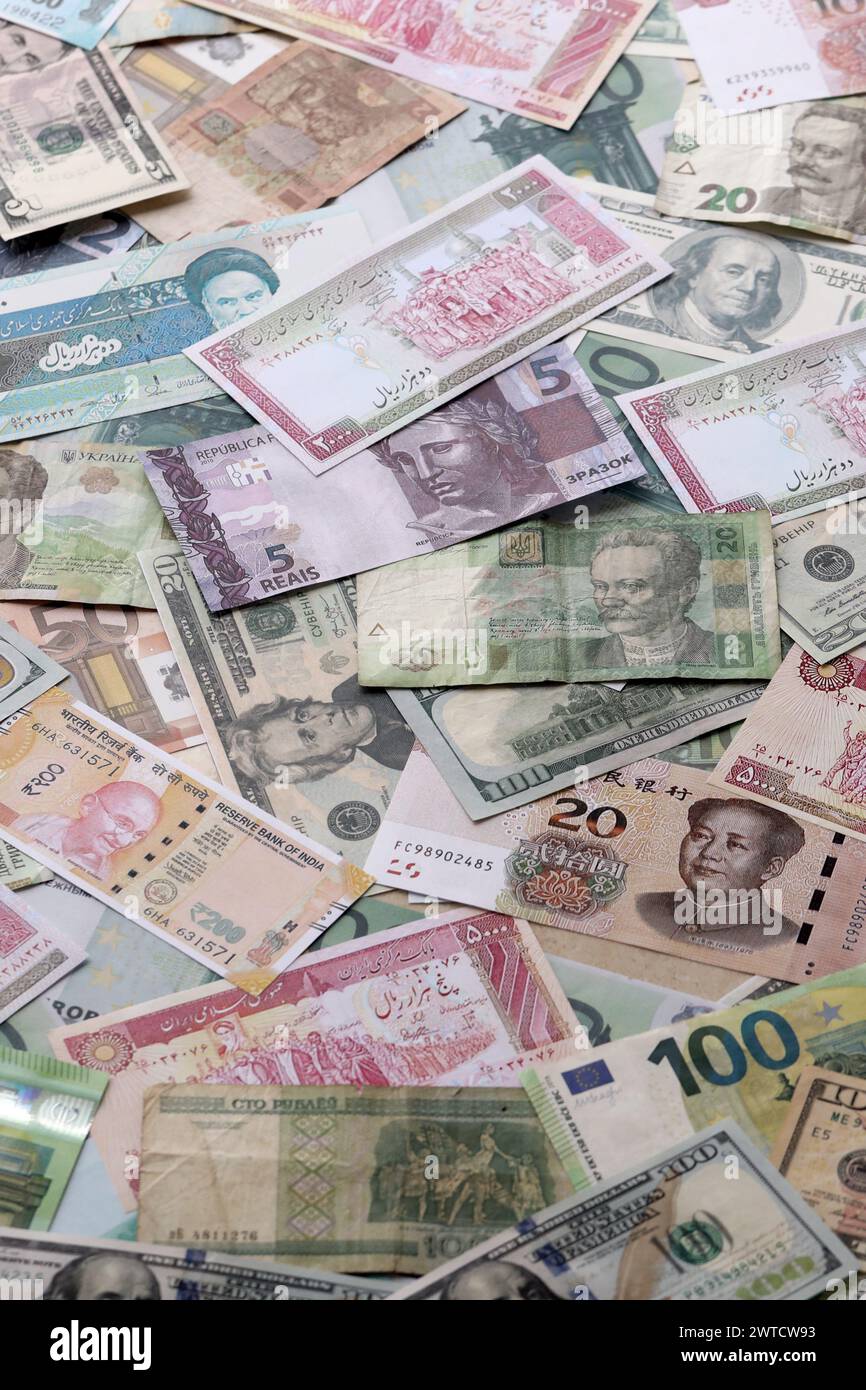 Many banknotes of different currency. Background of big amount of ...