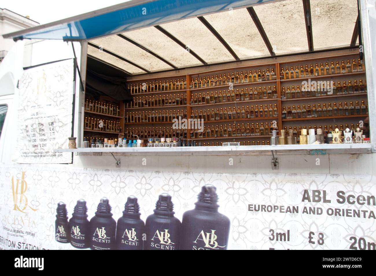 Mobile Perfume Stand in a Caravan; Brixton; London, UK - large supply of small perfume bottles; Stock Photo