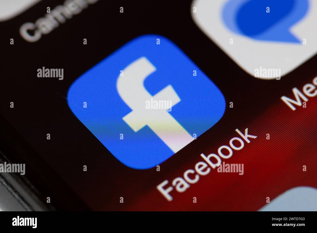 Facebook app icon on mobile phone Stock Photo