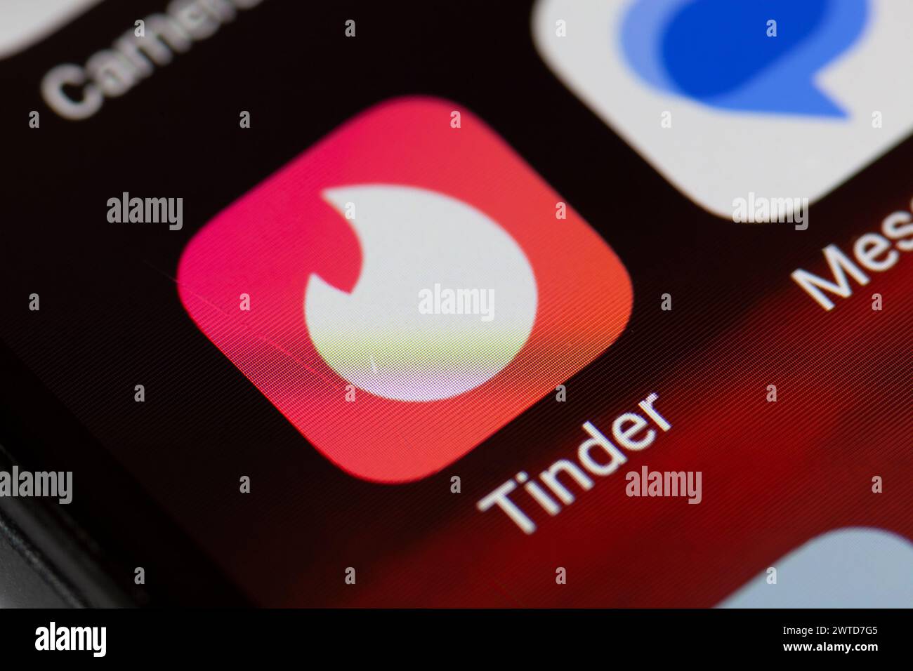 Tinder app icon on mobile phone Stock Photo