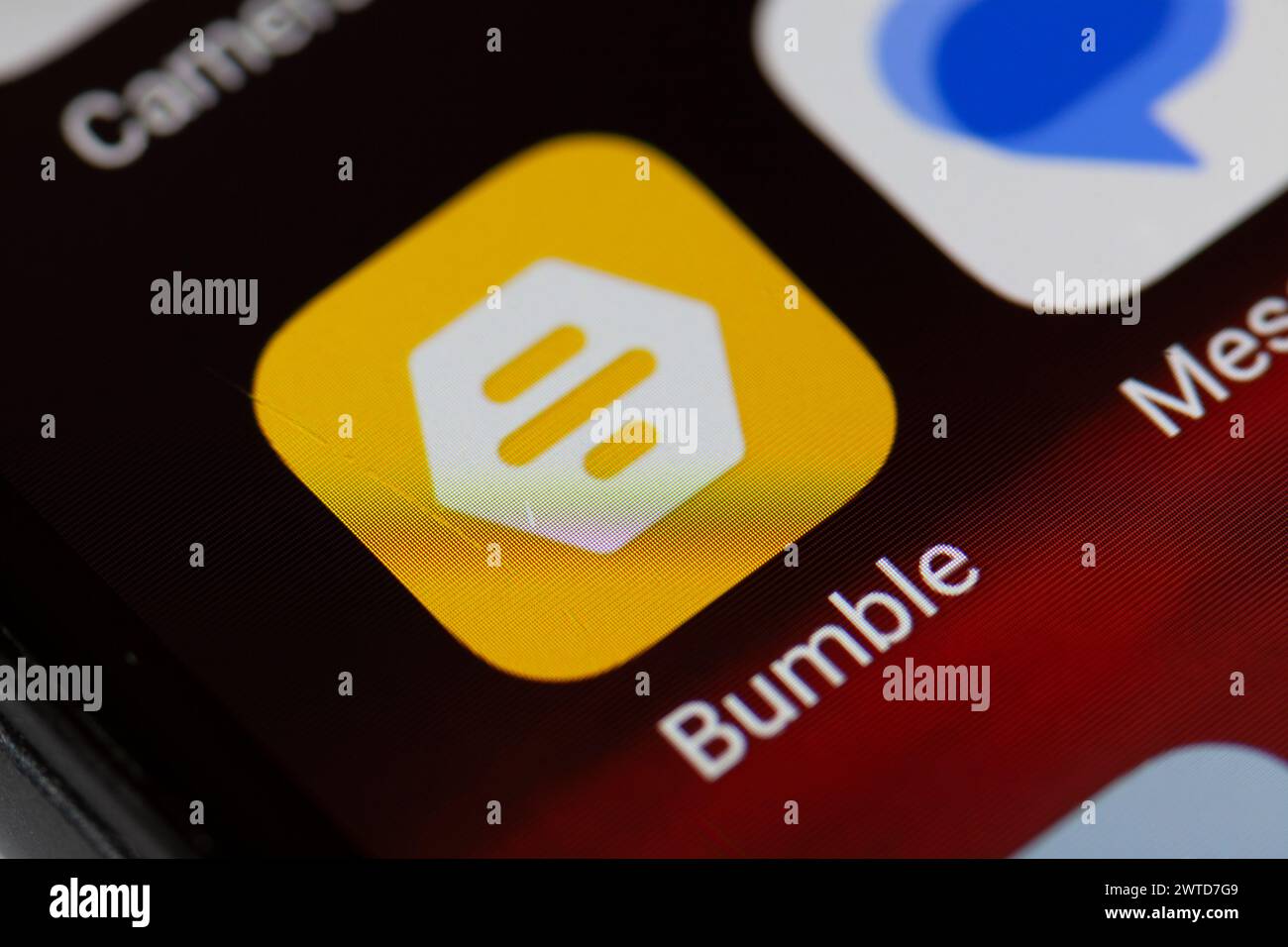 Bumble app icon on mobile phone Stock Photo