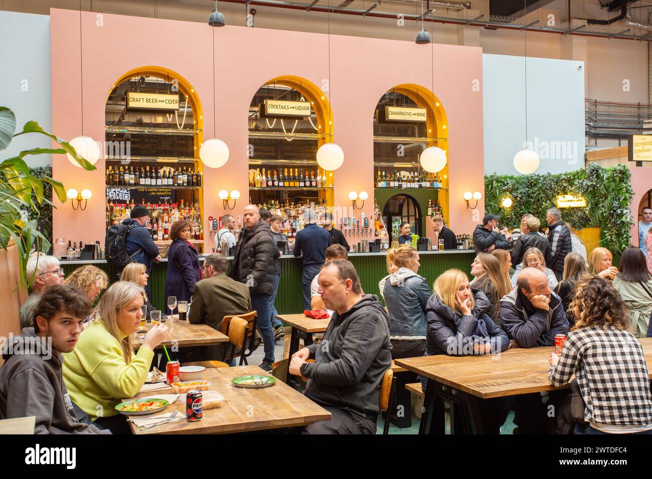 People eating and drinking in Chester Market  food  hall outlet Stock Photo