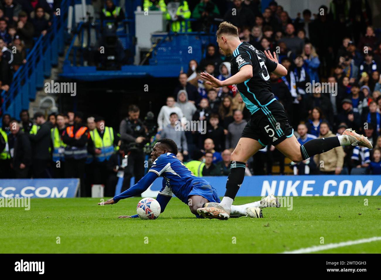LONDON, UK - 17th Mar 2024:  Nicolas Jackson of Chelsea goes down under the challenge of Callum Doyle of Leicester City for which the latter earns a red card after VAR review during the FA Cup quarter-final match between Chelsea FC and Leicester City FC at Stamford Bridge  (Credit: Craig Mercer/ Alamy Live News) Stock Photo