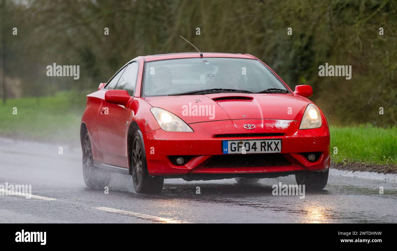 Milton Keynes,UK-Mar 17th 2024: 2004 red Toyota Celica car driving in ...