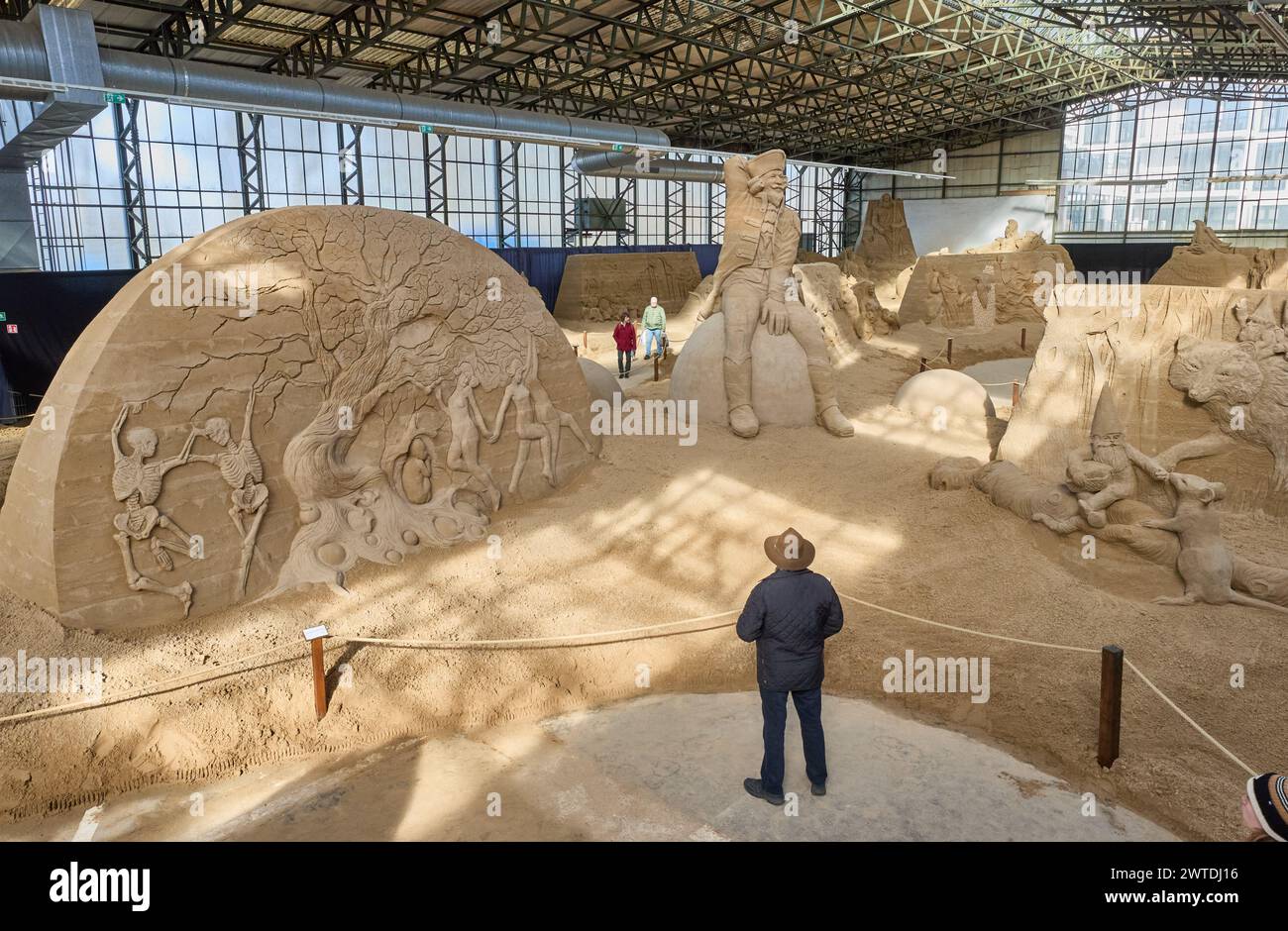 17 March 2024, Schleswig-Holstein, Travemünde: View of the artworks Tree of Life (l) by Kilian Van Der Velden from Holland and Baron von Münchhausen (M) by Stachu Nowodworski from Poland in the Travemünde sand sculpture exhibition. Photo: Georg Wendt/dpa - ATTENTION: Only for editorial use in connection with current reporting and only with full reference to the above credit Credit: dpa picture alliance/Alamy Live News Stock Photo