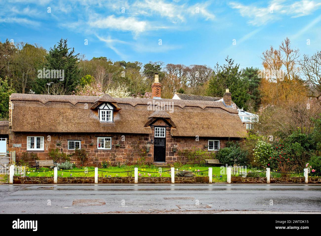 Traditional thatched country cottage in the Cheshire Wirral village of