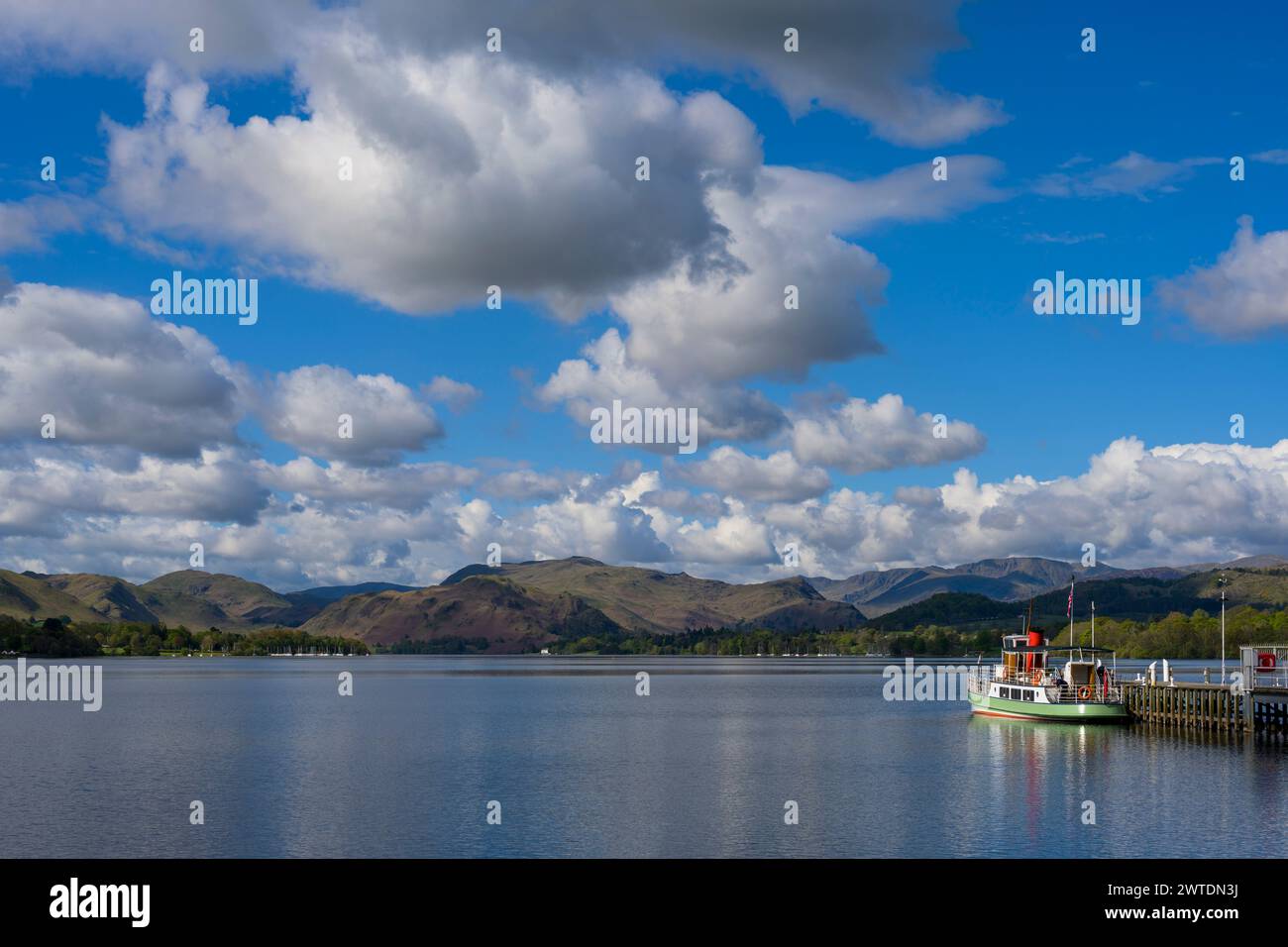 The Ullswater Steamer waits by the jetty on a sunny spring morning. Stock Photo