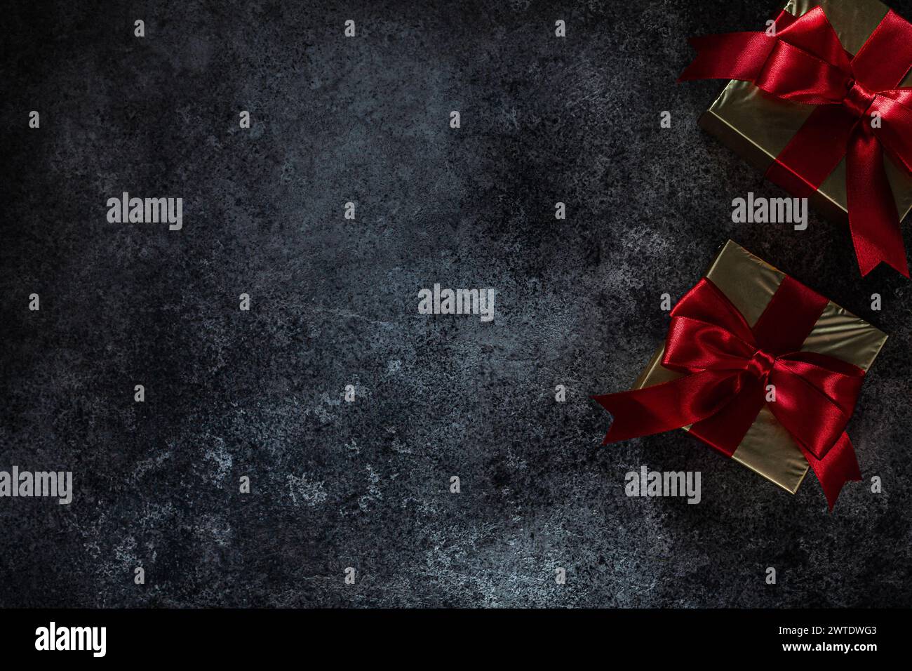 Two Golden Gift Boxes On Dark Background With Copy Space Stock Photo