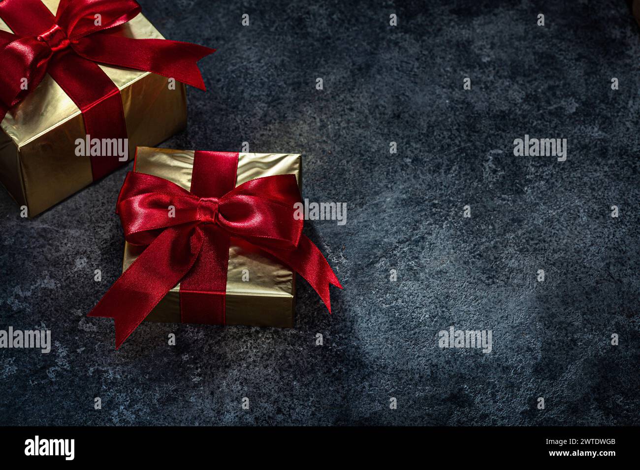 Golden Gift Boxes  On Dark Background Stock Photo