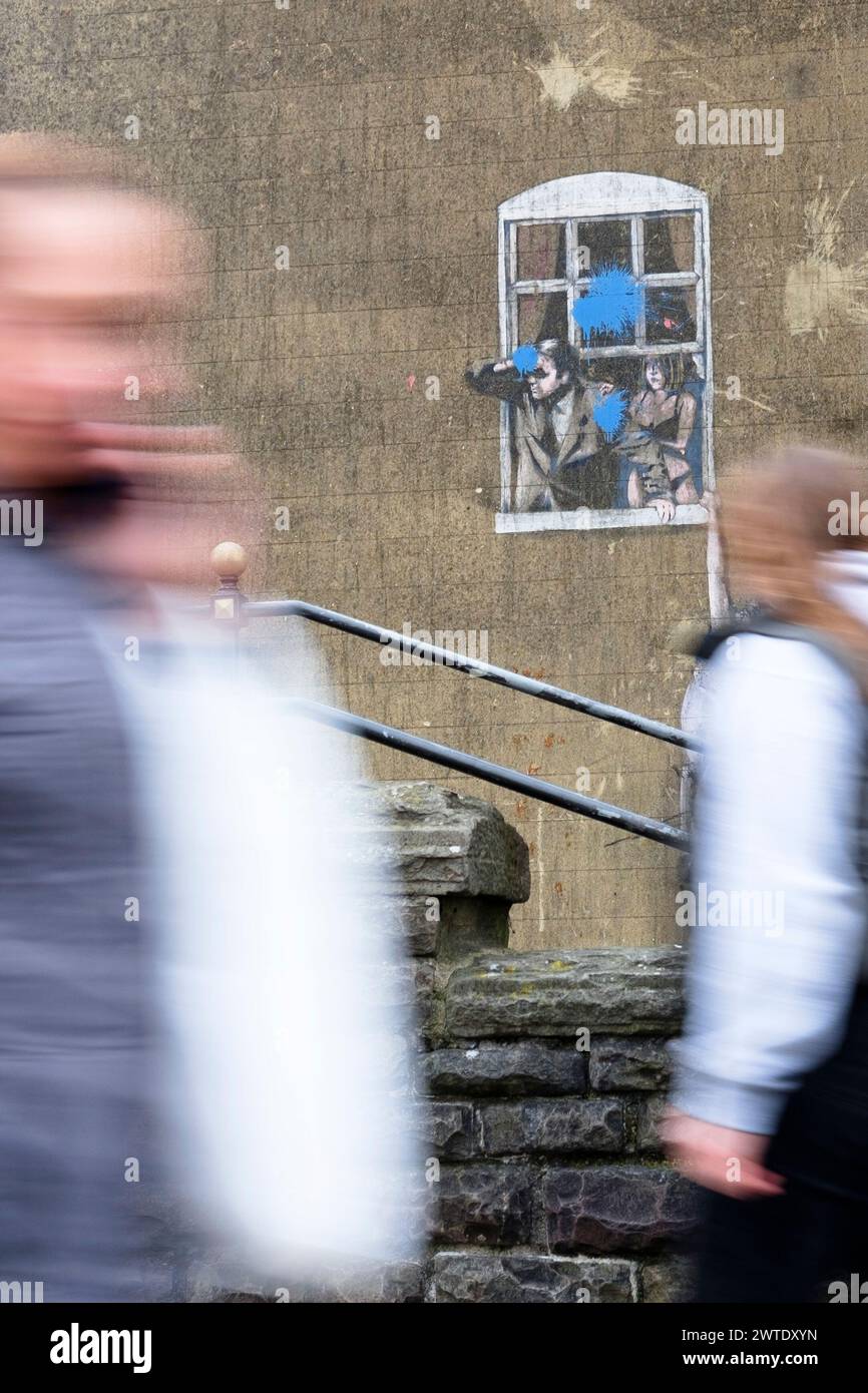 People walking past Banksys picture Well Hung Lover on Park st Bristol Stock Photo