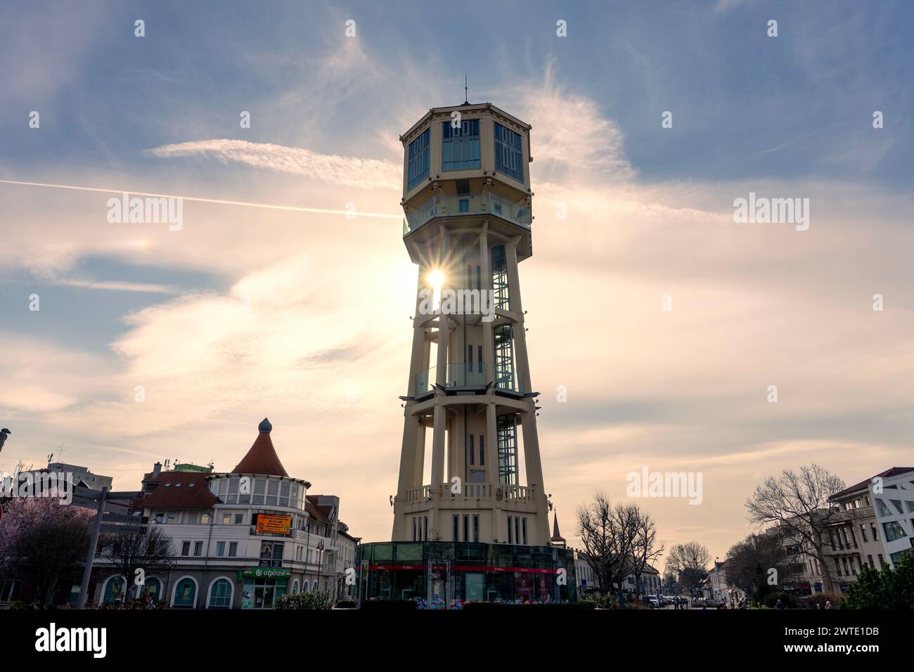 03.15.2024 - Siofok, Hungary: Siofok water lookout tower with blooming tree in Hungary spring travel . Stock Photo