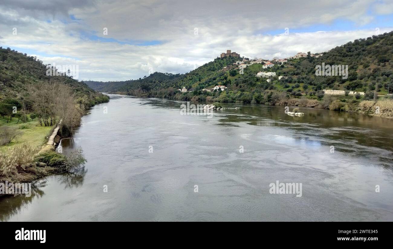 Tagus River, with the hilltop medieval Castle of Belver, on the right bank, overlooking the landscape, Belver, Portugal Stock Photo