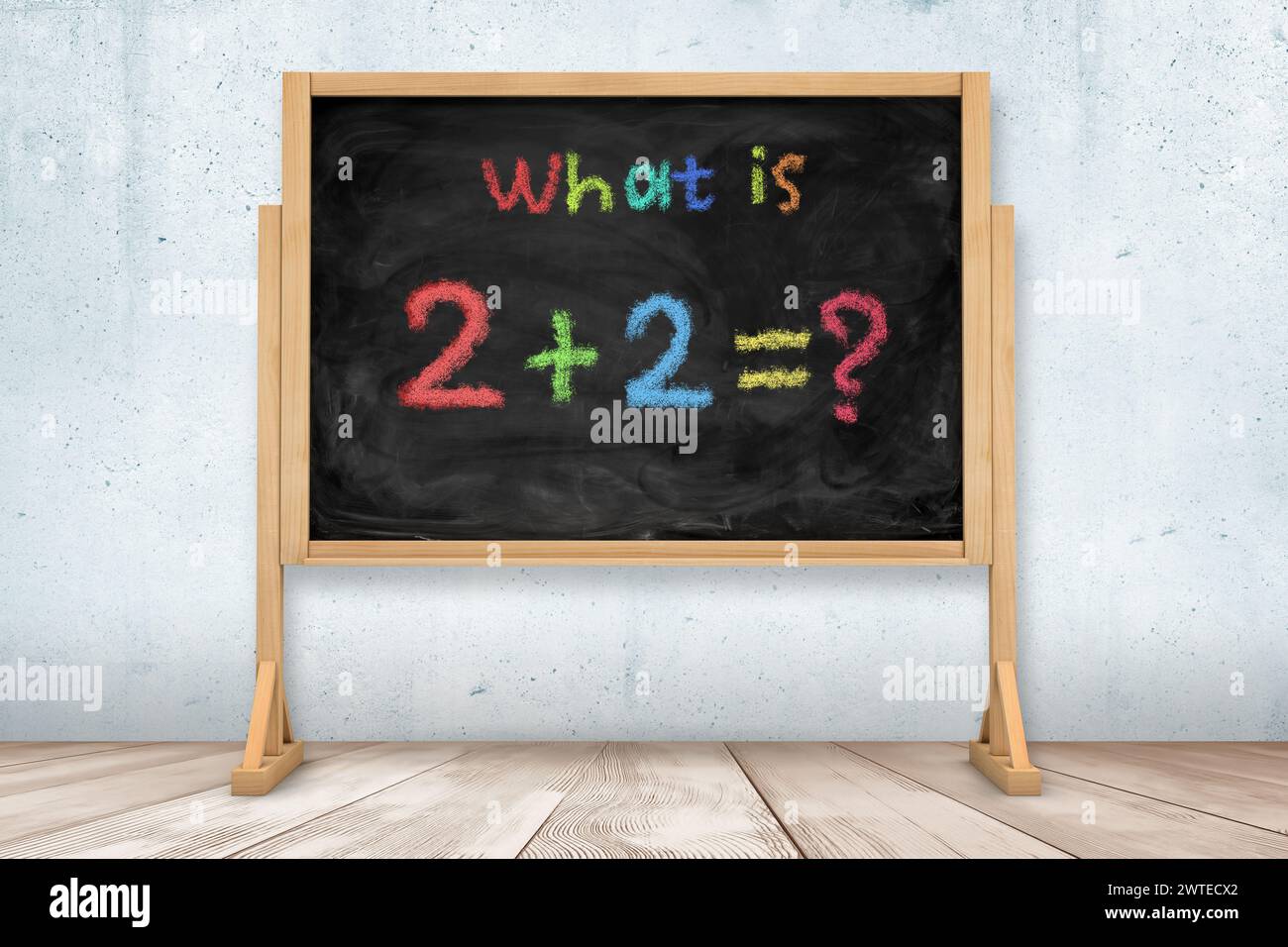 Simple math problem written on classroom blackboard Stock Photo
