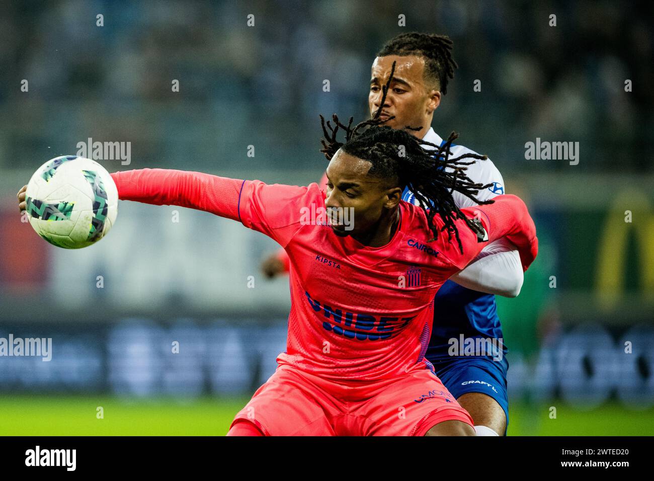 Gent, Belgium. 17th Mar, 2024. Charleroi's Jeremy Petris and Gent's Archibald Archie Brown fight for the ball during a soccer match between KAA Gent and Royal Charleroi Sporting Club, Sunday 17 March 2024 in Gent, on the last day (30 out of 30) of the 2023-2024 season of the 'Jupiler Pro League' first division of the Belgian championship. BELGA PHOTO JASPER JACOBS Credit: Belga News Agency/Alamy Live News Stock Photo