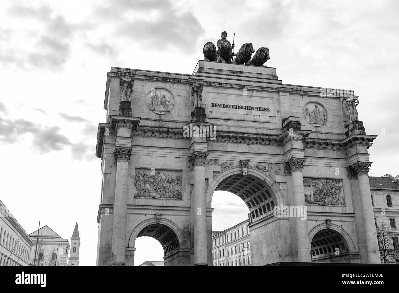 The Siegestor, The Victory Gate in Munich is a three arched memorial arch, crowned with a statue of Bavaria with a lion quadriga. Stock Photo