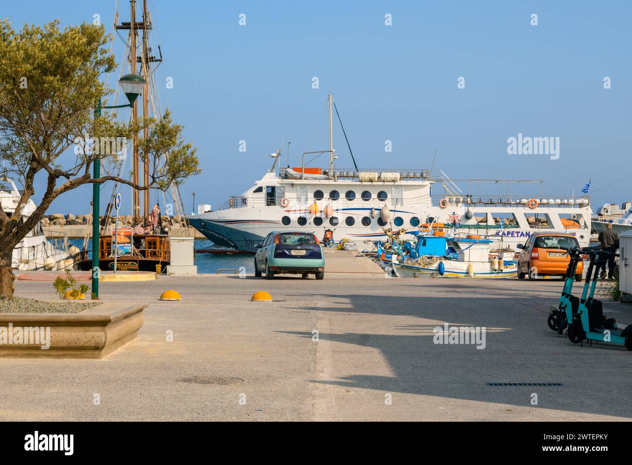 Kos, Greece - May 12, 2023: View of the street and port in Kardamena village on the island of Kos, Greece Stock Photo