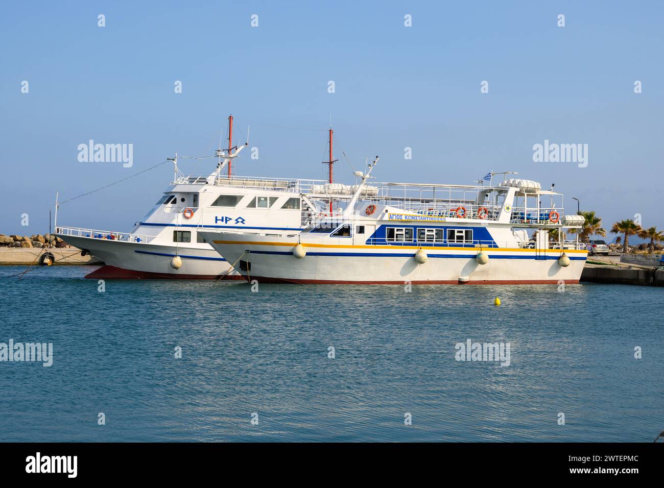 Kos, Greece - May 12, 2023: Cruise boats moored in the port of Kardamena. Kos island, Greece Stock Photo