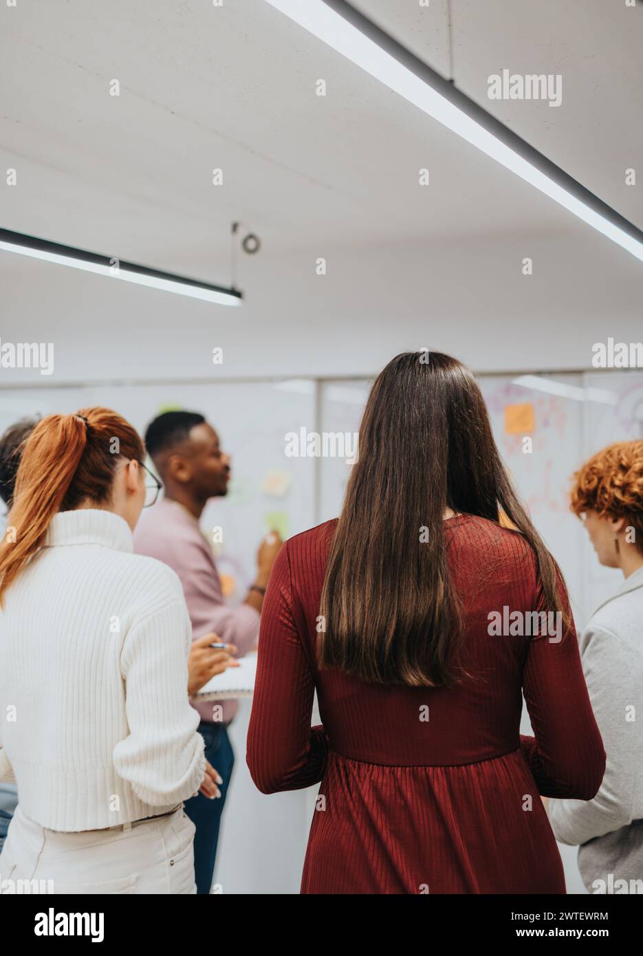 Multiracial colleagues collaborating in a creative corporate office Stock Photo