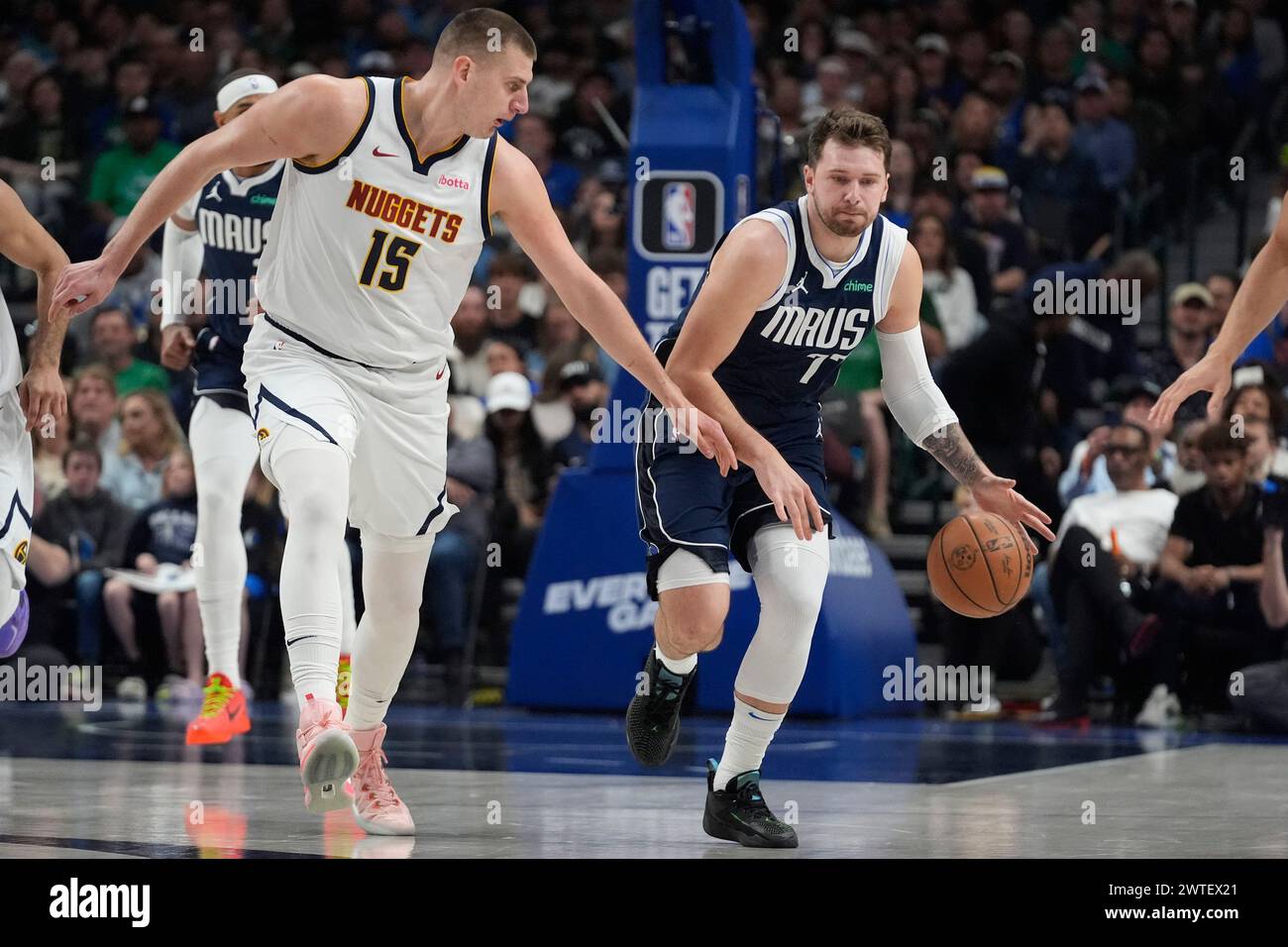 Dallas Mavericks guard Luka Doncic (77) dribbles against Denver Nuggets ...