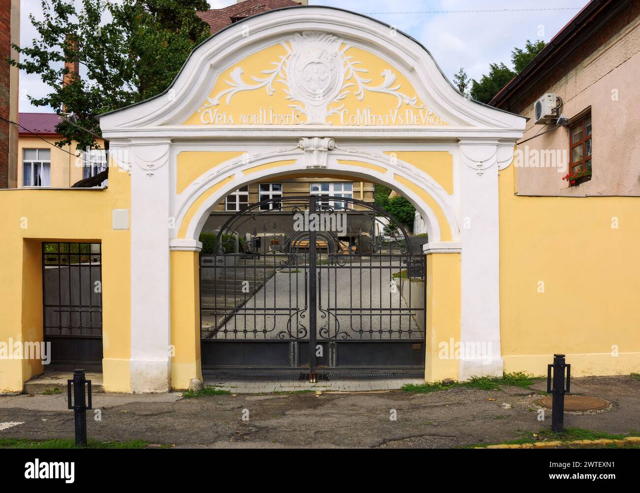 uzhgorod, ukraine - 28 jun 2016: transcarpathia academy of arts entrance with gate in renaissance style. architectural background Stock Photo