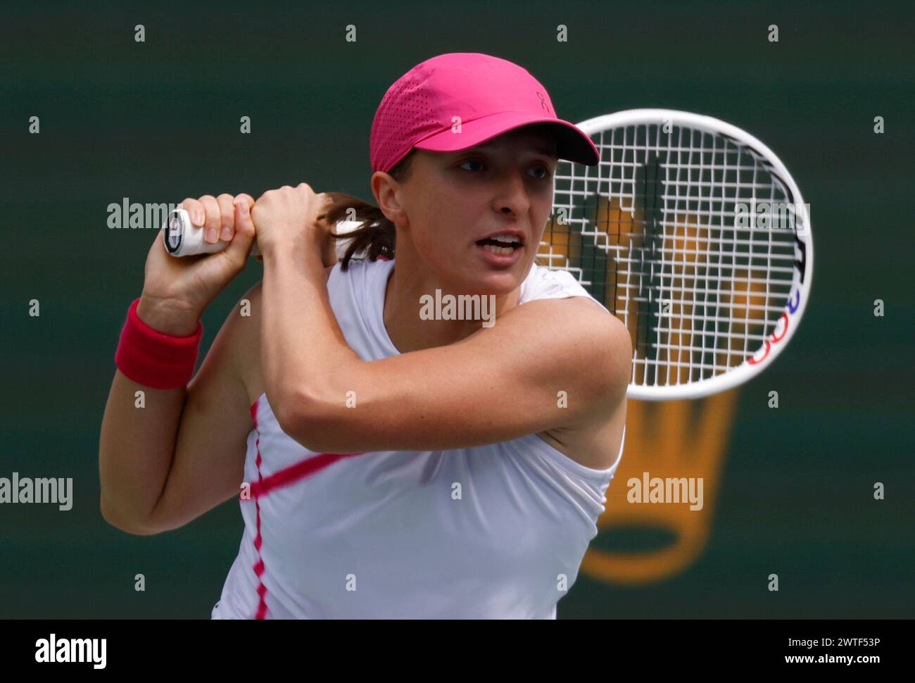 March 17, 2024 Iga Swiatek of Poland returns a shot against Maria