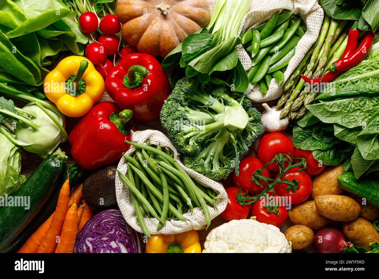 Vegetables background. Various vegetables on kitchen table. Clean eating, healthy food concept, flat lay, top down view Stock Photo