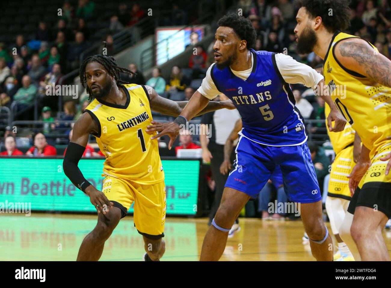 London, Canada. 17th Mar, 2024. London Ontario Canada. March 17 2024, The London Lightning defeat the Kitchener Titans 118-114 in regulation on St. Patrick's Day. Marcus Ottey (1) and Jermaine Haley Jr (10) of London Lightning double team Jaquan Lightfoot (5) of Kitchener Titans. Credit: Luke Durda/Alamy Live News Stock Photo