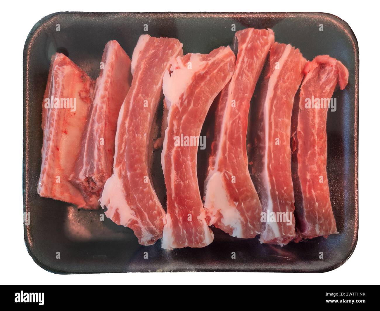 Clear Ribs Raw pork ribs in black plastic tray sealed with clear plastic film ...
