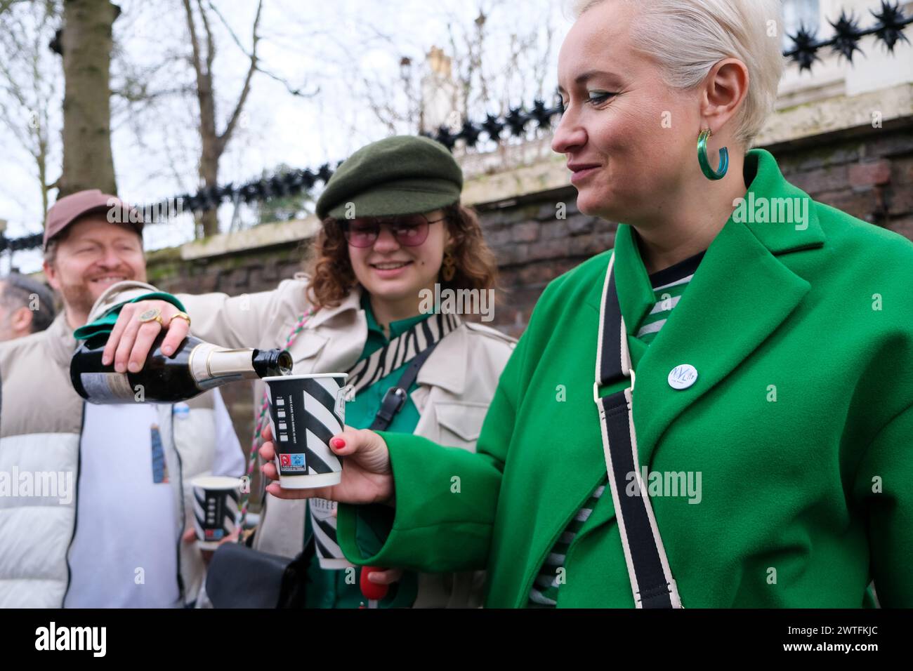 London, UK. 17th March, 2024. Voters crack open a bottle of prosecco as