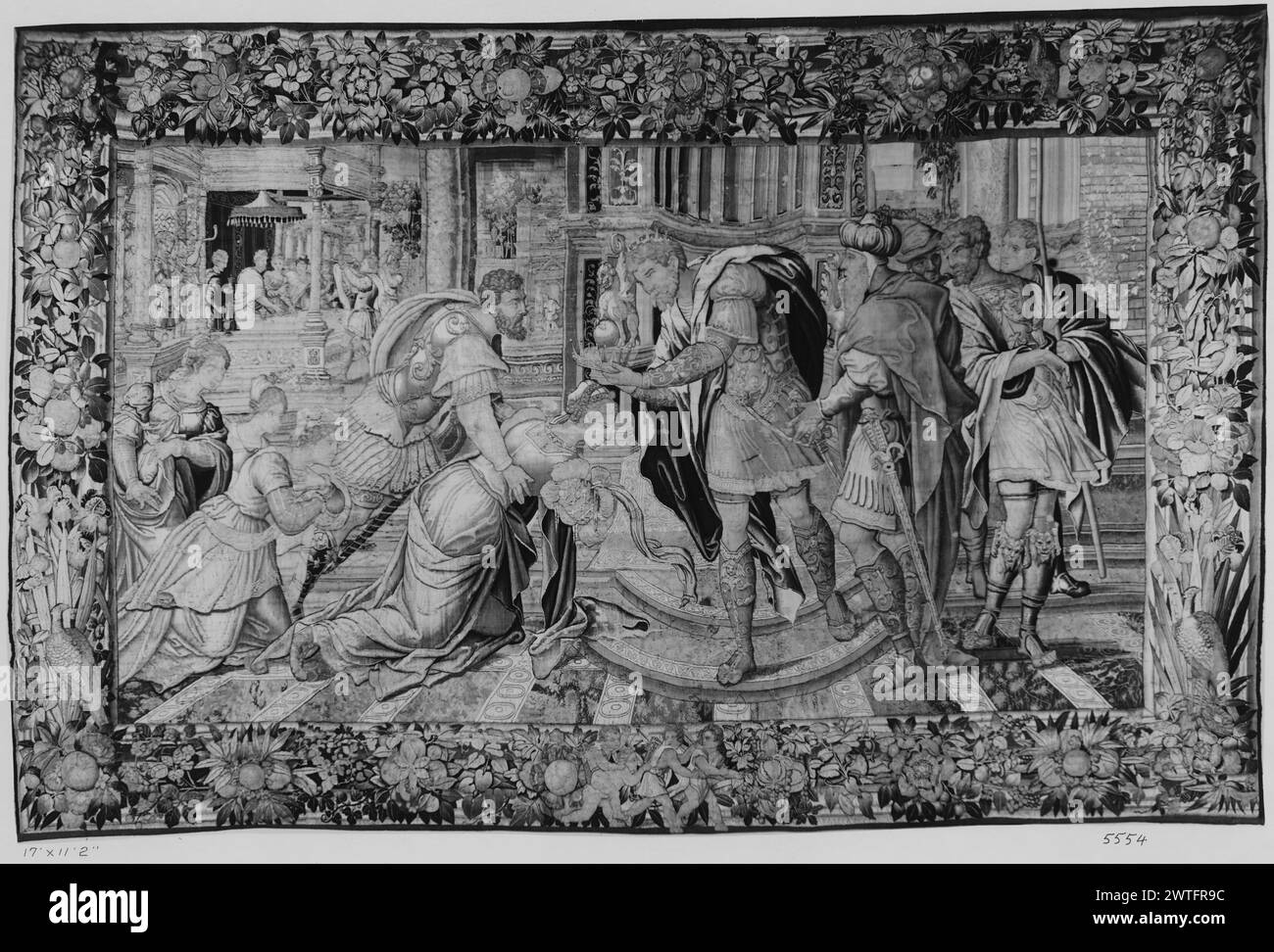 Esther and Ahasuerus: crowning of Esther. unknown c. 1530-1550 Tapestry Dimensions: H 11'2' x W 17' Tapestry Materials/Techniques: unknown Culture: Flemish Weaving Center: Brussels Ownership History: French & Co. received from De Witt, invoiced 7/3/1931; returned from consignment, 8/26/1932. Before architectural setting, Esther becomes queen as she is crowned by Ahasuerus; courtiers surround; L background, Esther's wedding feast (Esther 1-2:20) (BRD) bunches of oversize flowers & fruit against central palm tree trunk motif; (L & R BRD) large birds; fronds springing at bottom; (LWR BRD) centere Stock Photo