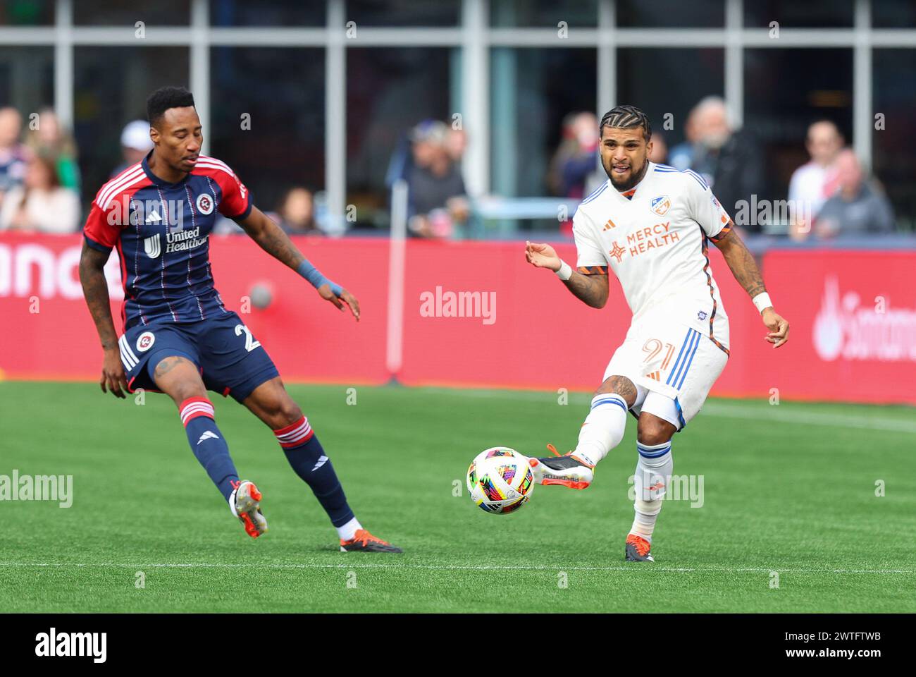 March 17, 2024; Foxborough, MA, USA; FC Cincinnati defender DeAndre Yedlin (91) and New England Revolution midfielder Mark-Anthony Kaye (28) in action during the MLS match between FC Cincinnati and New England Revolution. Anthony Nesmith/CSM (Credit Image: © Anthony Nesmith/Cal Sport Media) Stock Photo