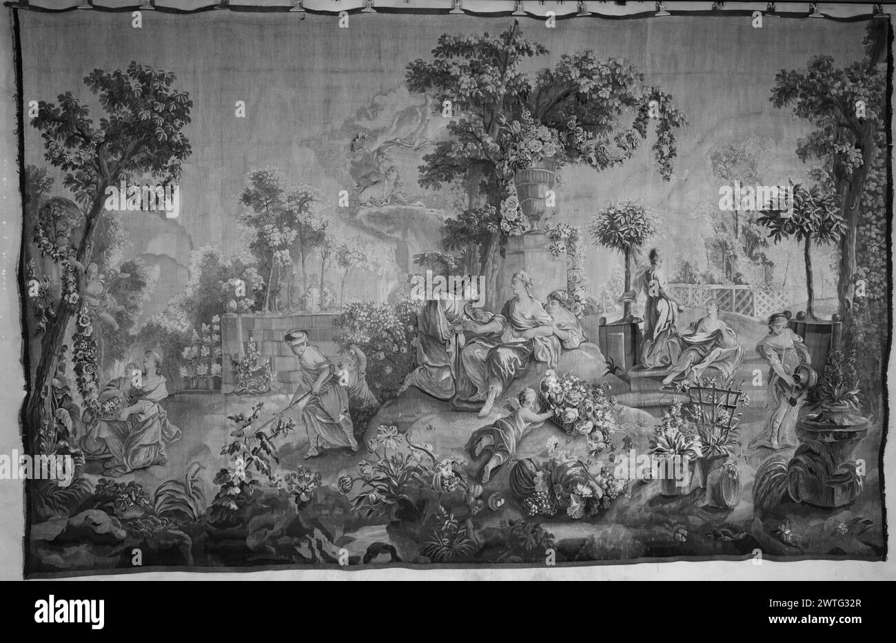 Vertumnus and Pomona. unknown c. 1760 Tapestry Dimensions: H 9'9' x W 15'3' Tapestry Materials/Techniques: unknown Culture: French Weaving Center: Aubusson Ownership History: French & Co. (stock sheet says: 'missing ...' & provides no other information). In garden park landscape with trees & flowering plants, Vertumnus in guise of old woman, wooing Pomona, near stone pedestal topped by large flower-filled vase in center of composition; maidens engaged in various gardening activities alongside cherubim (R & L); additional cherubim hovering in sky Borders missing. French & Co. stock sheet in arc Stock Photo