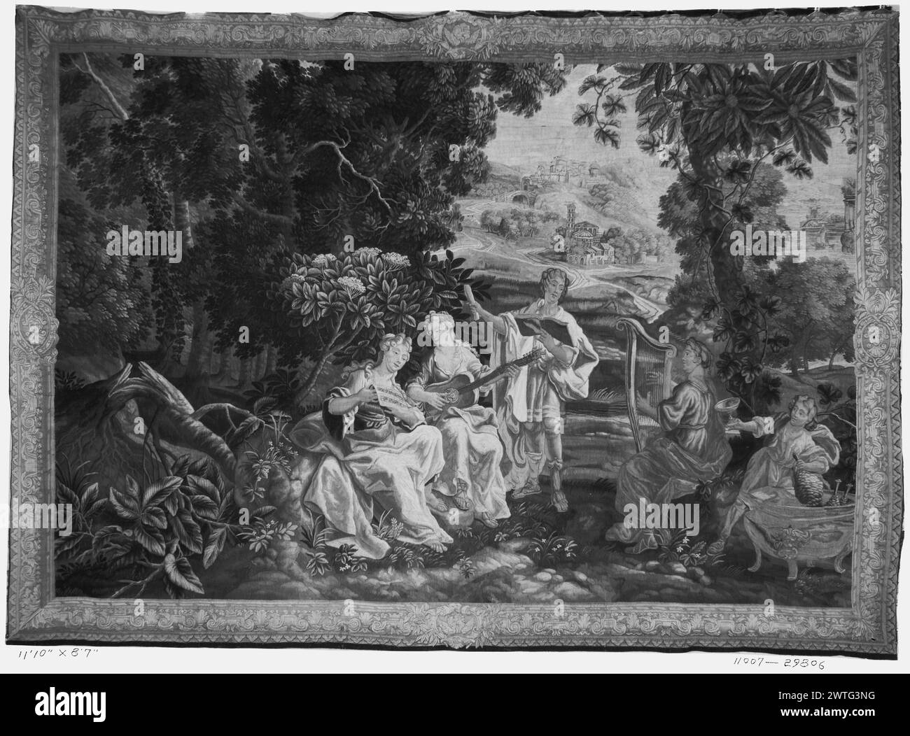 Musicians in landscape. unknown c. 1700 Tapestry Dimensions: H 8'7' x W 11'10' Tapestry Materials/Techniques: unknown Culture: Flemish Weaving Center: Lille Ownership History: French & Co. purchased from Mrs. John R. Livermore, invoiced 2/19/1927. In forest, group of musicians, including 2 women playing guitar & harp while man & woman hold music (singers?); small child stands near vat with jugs of wine (?) while holding chalice (BRD) abstracted foliage interspersed with architectural moldings, portrait medallions set in central cartouches on every side Stock sheet states that tapestry was sent Stock Photo