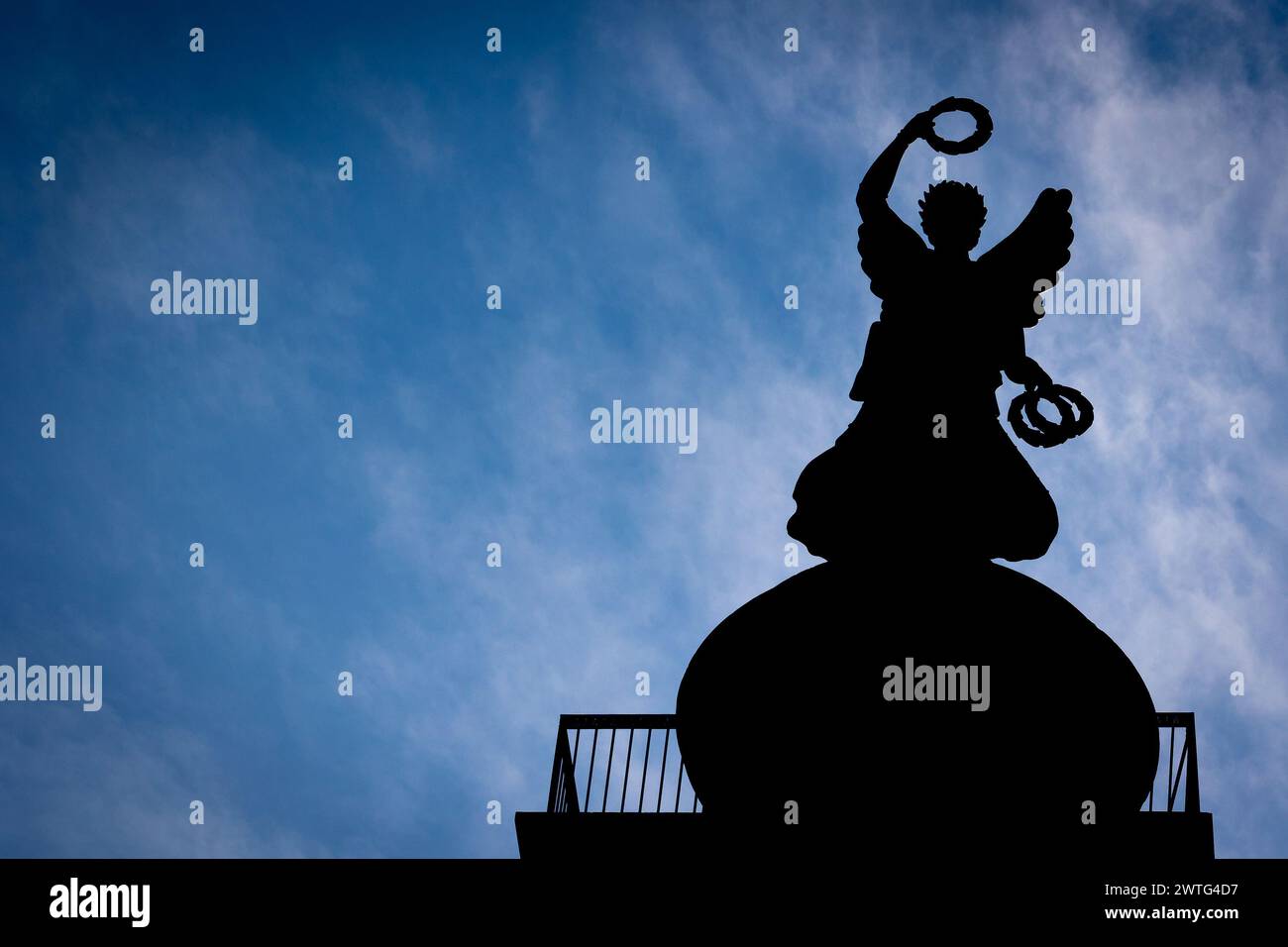 Hanover, Germany. 17th Mar, 2024. The Victoria on the Waterloo Column in the Calenberger Neustadt district can be seen as a silhouette against the light. Credit: Moritz Frankenberg/dpa/Alamy Live News Stock Photo