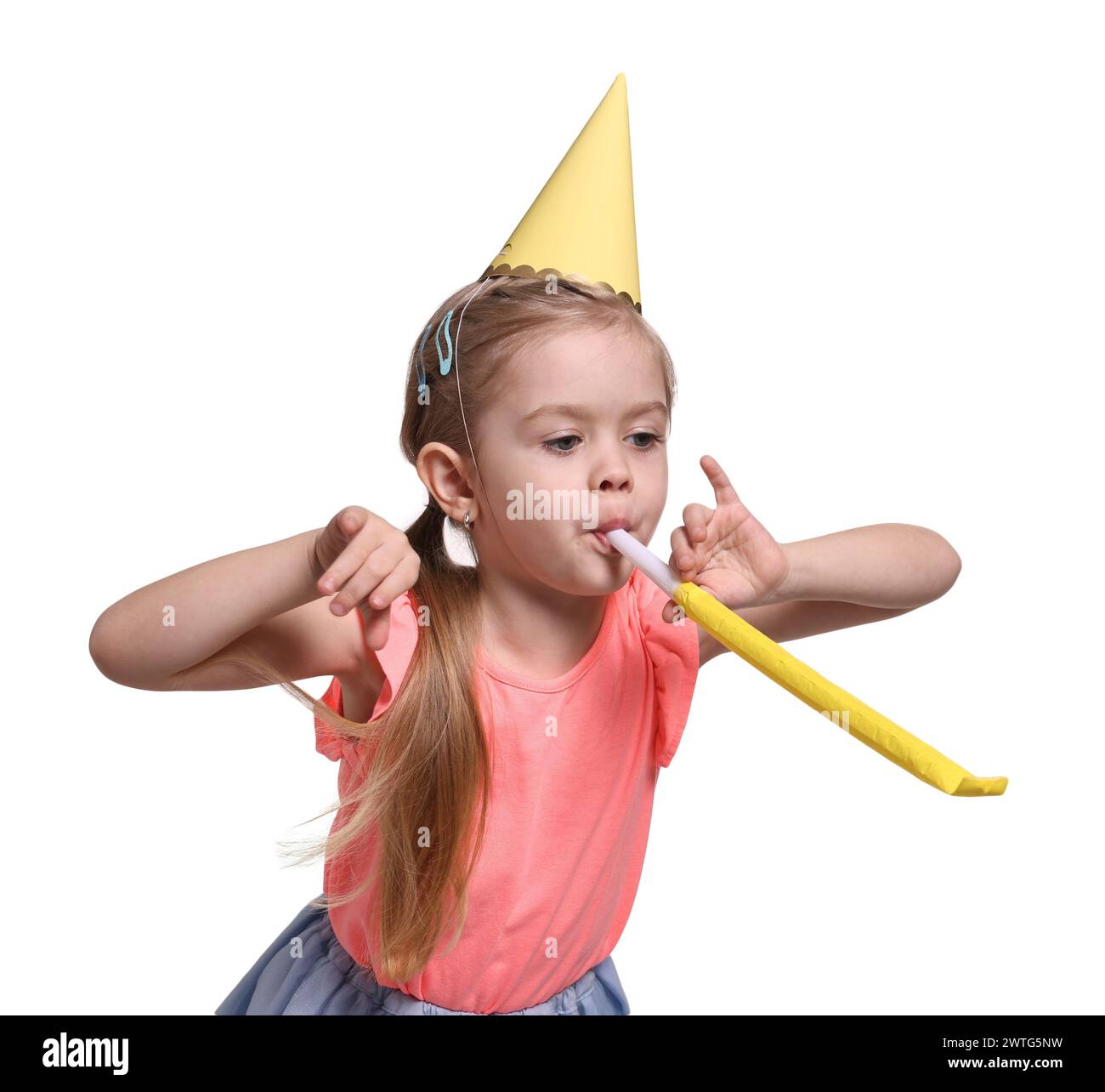 Birthday celebration. Cute little girl in party hat with blower on ...
