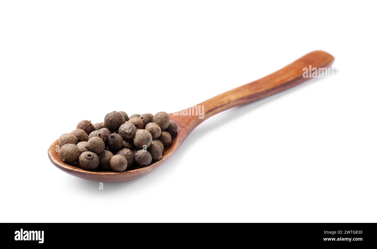 Dry allspice berries (Jamaica pepper) in spoon isolated on white Stock