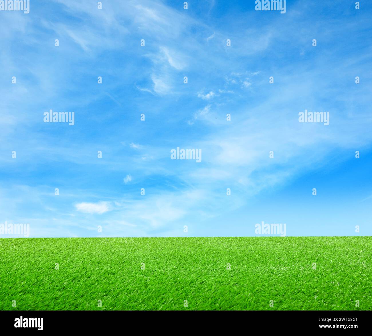 Green grass under blue sky with clouds Stock Photo - Alamy