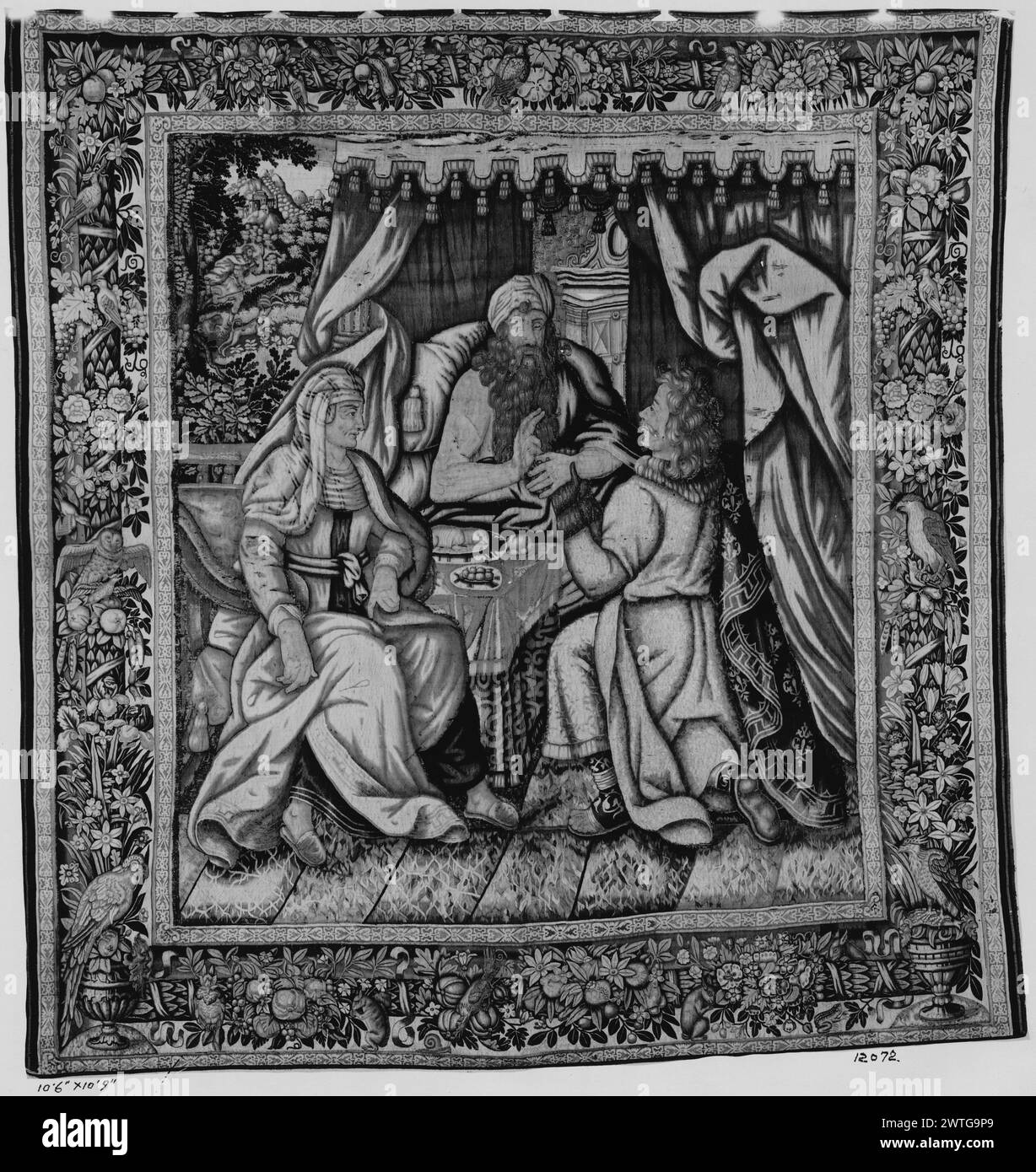 Isaac's blessing of Jacob and Esau. unknown c. 1625-1650 (central field) Tapestry Dimensions: H 10'9' x W 10'6' Tapestry Materials/Techniques: unknown Culture: Flemish Weaving Center: unknown Ownership History: French & Co. In bedchamber, Isaac lying in bed blesses Jacob who, disguised in Esau's clothes, brings food to his father; Jacob's hands & neck are covered with goatskins (Genesis 27) (BRD) garland of flowers & fruit with animals (birds & squirrels) twisting around central rod with palm tree trunk motif; (LWR BRD) birds perched atop vases with flowers The border & the [central] field sho Stock Photo