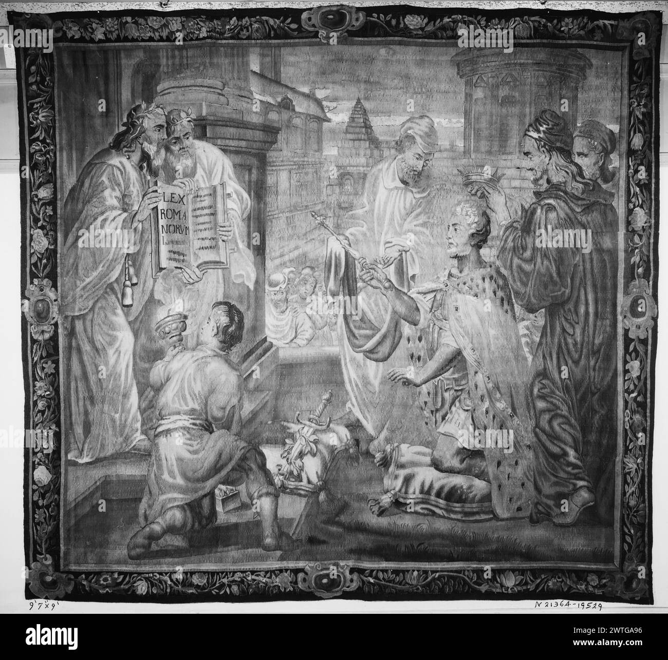 Crowning of emperor. unknown c. 1670 Tapestry Dimensions: H 9' x W 9'7' Tapestry Materials/Techniques: unknown Culture: Flemish Weaving Center: Antwerp Ownership History: French & Co. received from Joseph Gillis, invoiced 8/18/1939; returned 7/17/1954. Marcus Aurelius kneels, before 2 men who hold open large book, while another man crowns him (BRD) twisting garland of flowers & fruit, empty central cartouches on each side Stock sheet states that this tapestry is English. French & Co. stock sheet in archive, 19529 Stock Photo