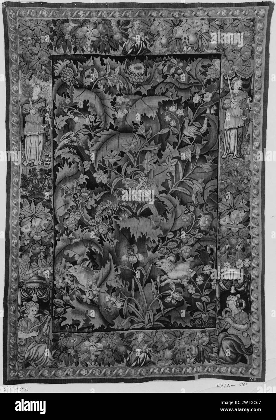 Large-leaf verdure (feuille de choux) with parrot, lion and deer. unknown c. 1550 Tapestry Dimensions: H 9'2' x W 6'4' Tapestry Materials/Techniques: unknown Culture: Flemish Weaving Center: Enghien Ownership History: French & Co. purchased from Antique Rug Studios 7/26/1915 [SS 2976]. French & Co. purchased from Mrs. Georgia Bostder, 8/28/1941 [SS 75481]. Inscriptions: City mark on lower guard, right Inscriptions: unidentified weaver mark on lower guard, right Central parrot, other birds, & lion chasing deer below; amidst giant, scrolling acanthus-like leaves with serrated edges, & flowering Stock Photo