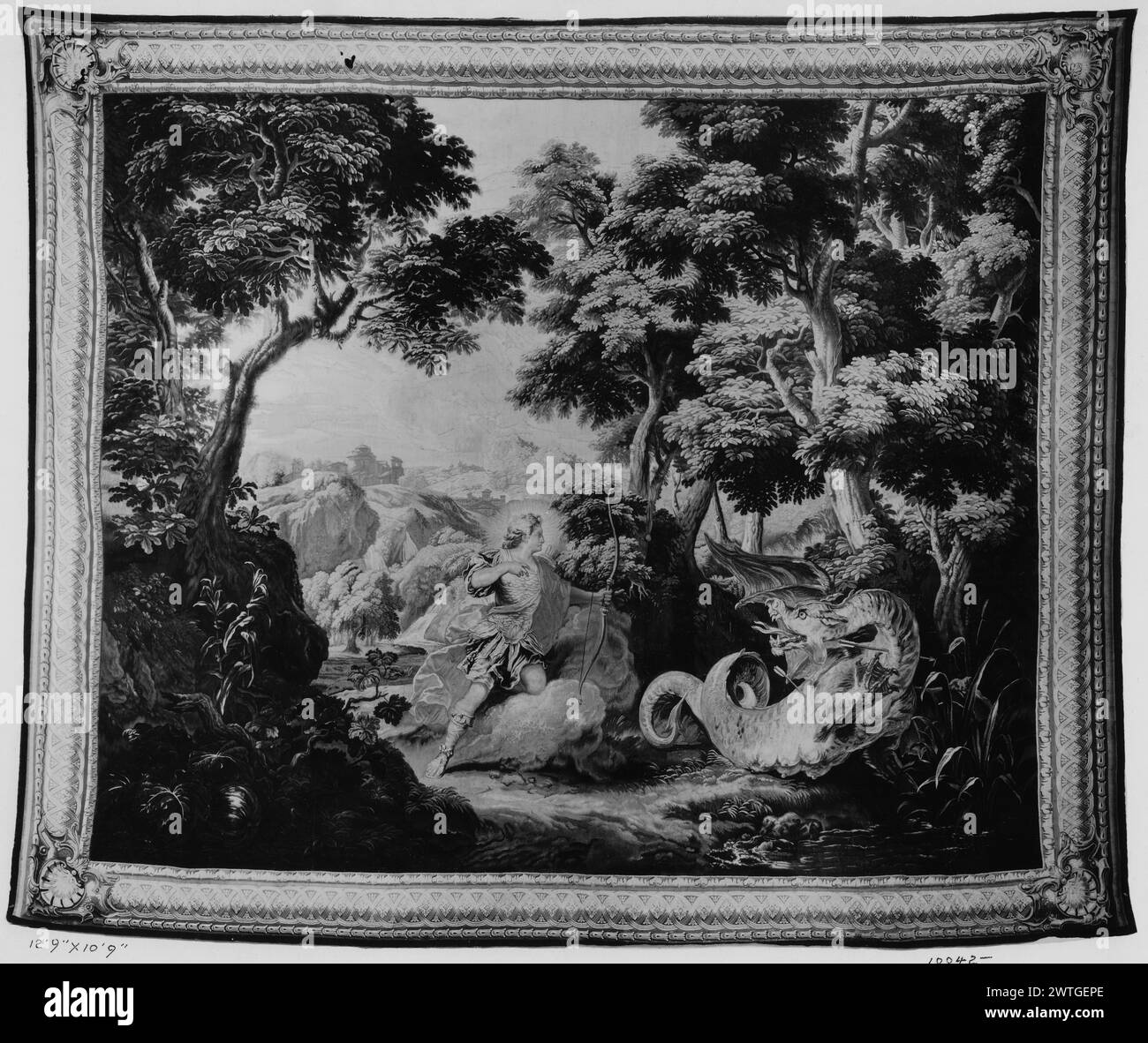 Apollo and the dragon Python. Bertin, Nicolas (French, 1668-1736) (author of design & cartoon creator, figures) [painter] Bonnart, Robert (French, 1652-aft.1729) (cartoon creator, landscape) [painter] c. 1704-1720 Tapestry Dimensions: H 10'10' x W 12'7' Tapestry Materials/Techniques: wool & silk Culture: French Weaving Center: Paris Ownership History: French & Co.?. Gift of Mrs. Matthias Plum. United States, Ohio, Cleveland, Cleveland Museum of Art, accno. 56-327. Apollo shoots Python with bow & arrows in wooded landscape (BRD) picture-frame border with interlaced rosetted strapwork, shell car Stock Photo