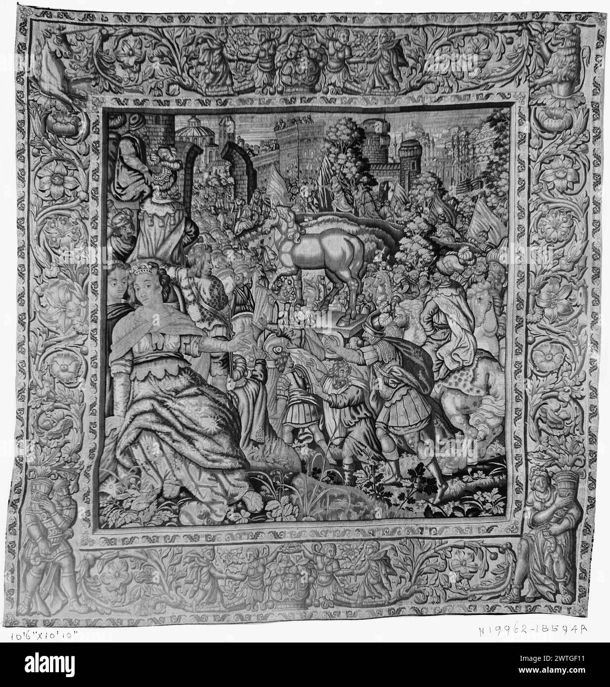 Wooden horse is brought into city of Troy. unknown c. 1620-1660 Tapestry Dimensions: H 10'10' x W 10'6' Tapestry Materials/Techniques: unknown Culture: Flemish Weaving Center: Brussels Ownership History: French & Co. purchased from Robert L. Gerry, invoiced 4/3/1936 [SS 18594]. Minerva (Athena) points toward Trojan horse as it is being moved toward city gate (BRD) acanthus scroll inhabited by various figures, lion & horse The tops of the side borders have been cut down (Campbell). French & Co. stock sheet in archive, 18594-a [also lists: 41436] Related Works: Panels in set: GCPA 0240973-024097 Stock Photo
