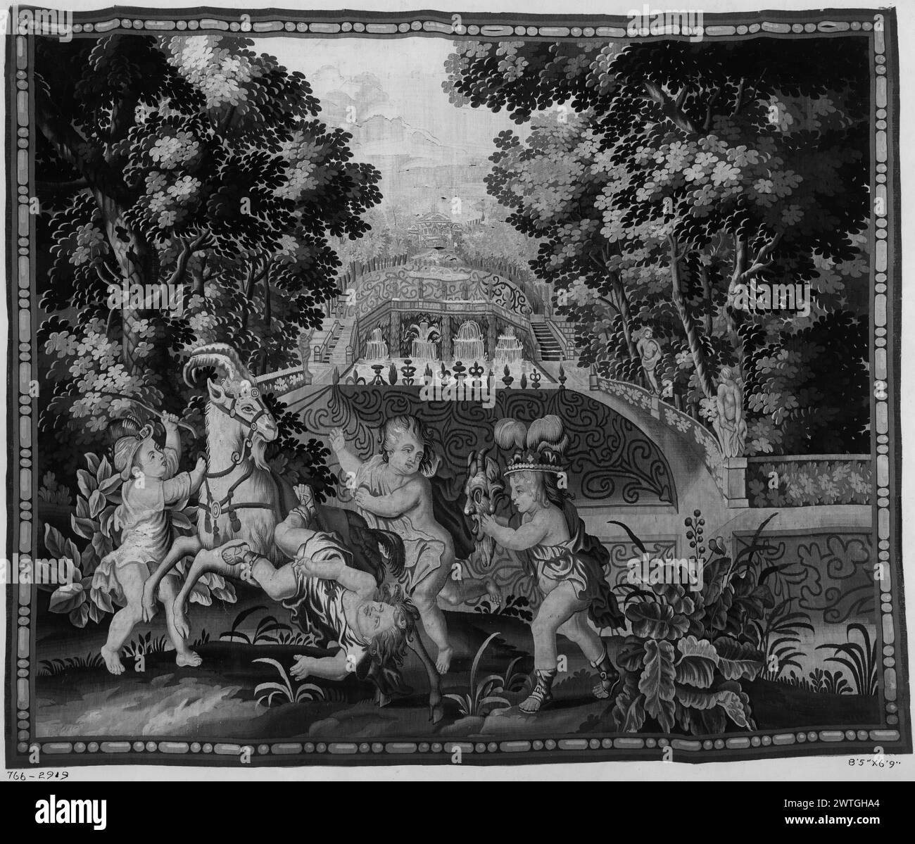 Bacchanalian children. unknown c. 1690 Tapestry Dimensions: H 6'9" x W 8'5" Tapestry Materials/Techniques: unknown Culture: English Weaving Center: Mortlake Ownership History: French & Co. purchased from De Souhami 5/5/1916. 4 boys playing with goat 1 tumbling off, 1 wears Indian-style headdress & holds mask (foreground), stylized garden with fountains & architectural scene (background) (BRD) bead-&-reel molding Marillier discusses a set of 7 panels at Cotehele in which this tapestry matches the description (see pl. 10b). He also identifies 2 other copies: 1 belonged to Mrs. Fetherston-Godly, Stock Photo