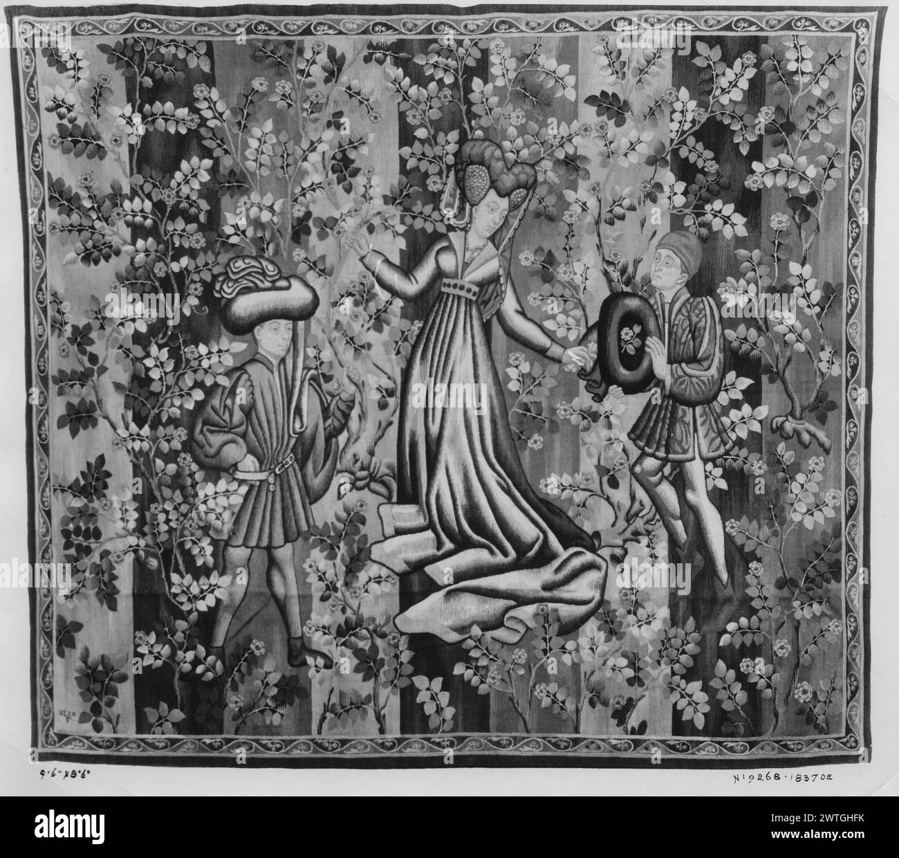 Figures in rose garden. unknown c. 1500-1525 Tapestry Materials/Techniques: unknown Culture: Southern Netherlands Weaving Center: unknown Ownership History: French & Co. purchased from Lorenz Kleiser, invoiced 3/21/1935. Lady & 2 gentlemen against stripped ground with rose bushes (BRD) teardrop twisting vine Fragment of tapestry; borders missing. Tapestry was exhibited in New York at the Metropolitan Museum of Art, Jan.13-Feb. 16, 1919, in the exhibition entitled, 'The Museum as a Laboratory' French & Co. stock sheet in archive, 39892-c [also lists: 18370] French & Co. stock sheet missing from Stock Photo