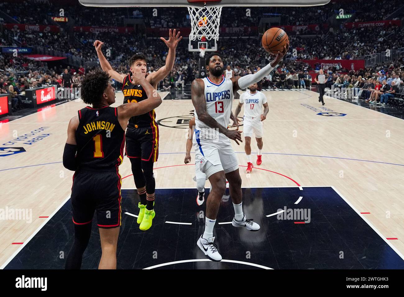 Los Angeles Clippers forward Paul George (13) shoots during the first half of an NBA basketball game against the Atlanta Hawks in Los Angeles, Sunday, March 17, 2024. (AP Photo/Ashley Landis) Stock Photo