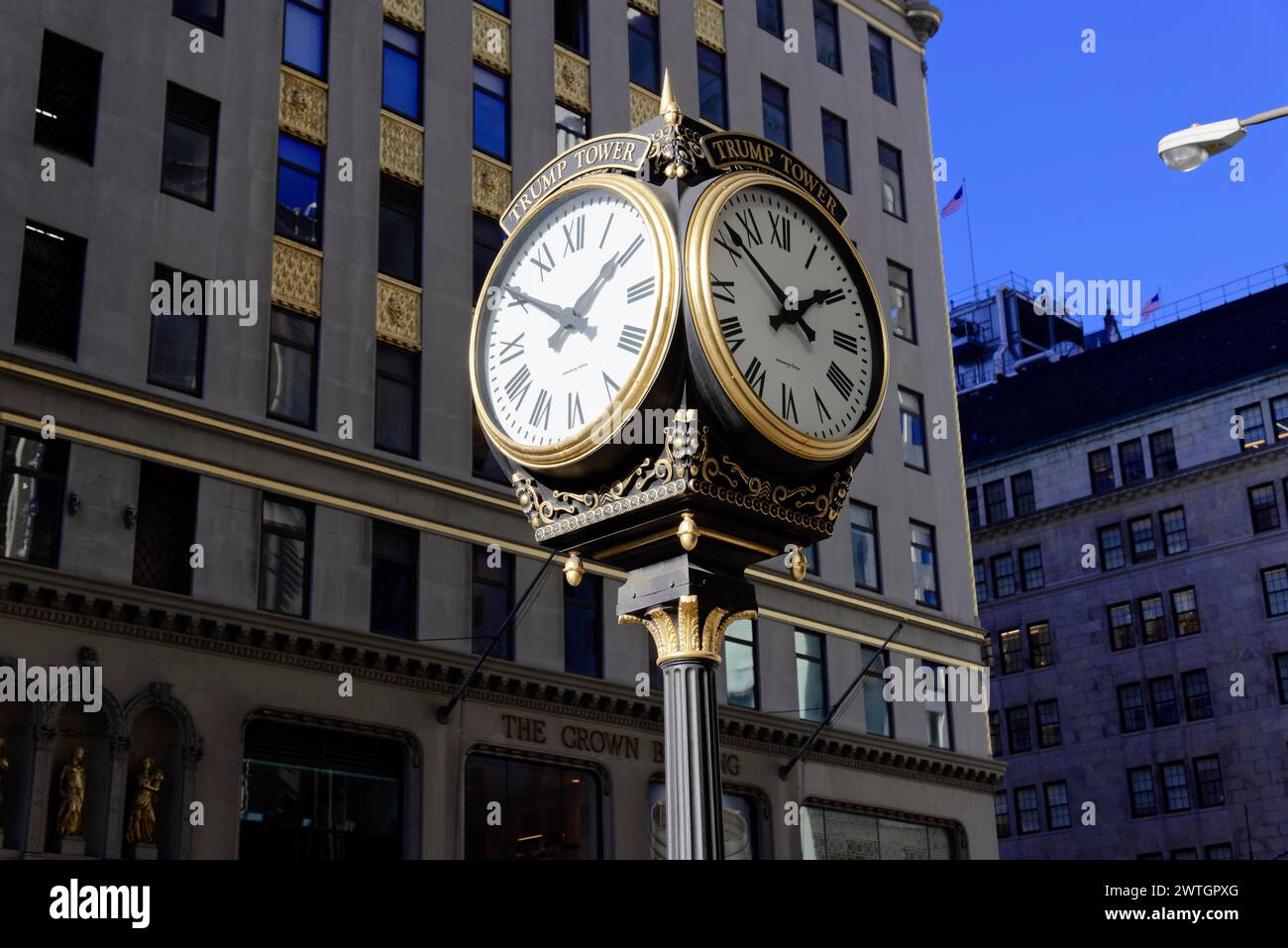 Large golden street clock with four dials in front of a building under daylight, Manhattan, New York City, New York, USA, North America Stock Photo