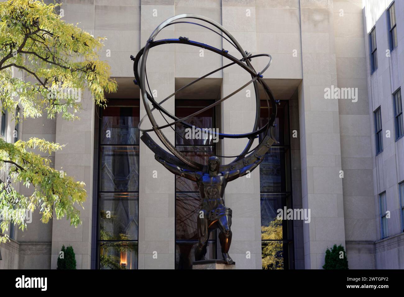 Rockefeller Center, sculpture of Atlas carrying a globe in front of a building, Manhattan, New York City, New York, USA, North America Stock Photo